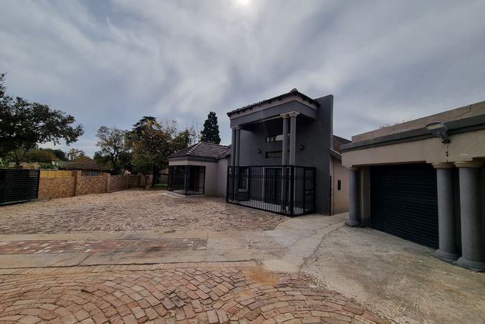 For Sale: House in Stilfontein Ext 3 with pool, staff quarters, and security features.