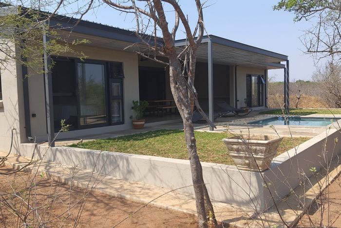 House for Sale in Hoedspruit Central: Wildlife Estate with Airstrip, Pool, and Fiber Internet.