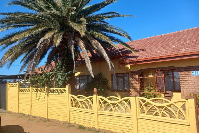For Sale: Spacious 4-bedroom house in Roodepan, near schools, with patio and parking.