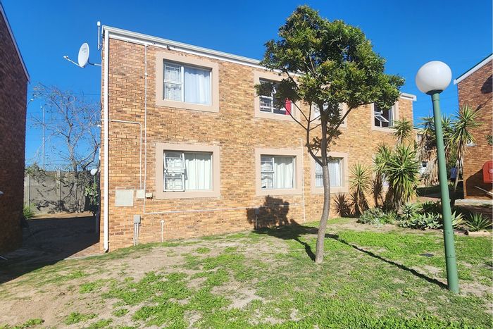 For Sale: Oakglen Apartment with 2 Bedrooms, Parking, Pool, and Rental Income.
