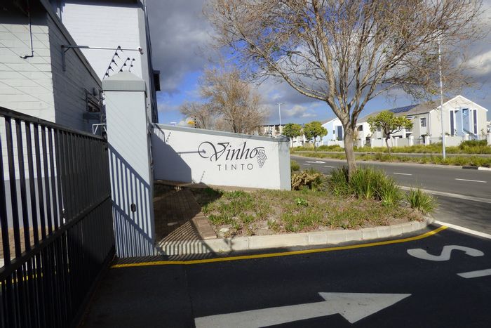 Two-bedroom apartment for sale in Burgundy Estate with patio braai and secure parking.