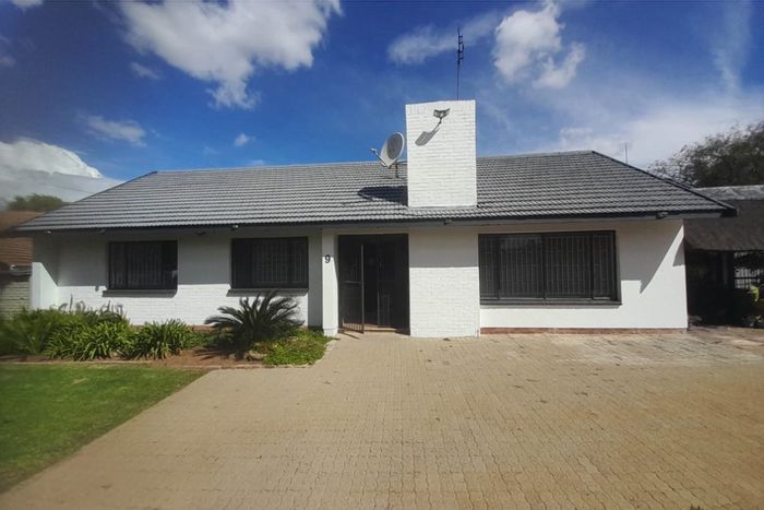 For Sale: Spacious Meiringspark house with flatlet, carports, and outdoor entertaining areas.