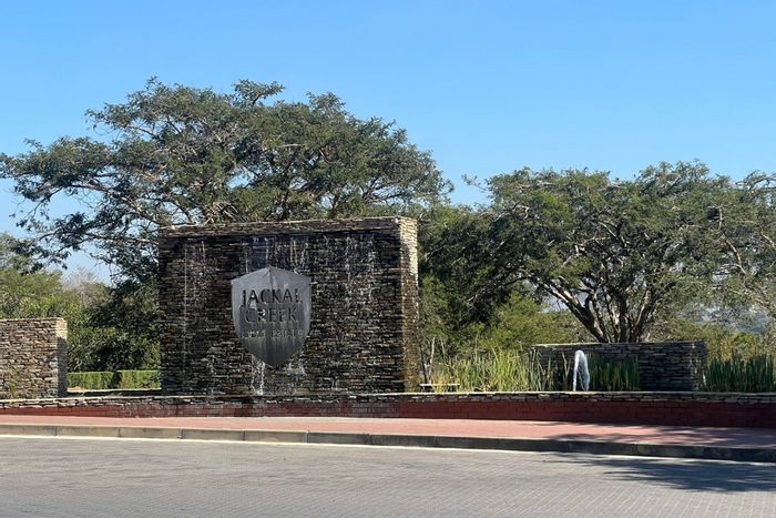 1-Bedroom Apartment To Rent in Jackal Creek Golf Estate with amenities and communal garden.