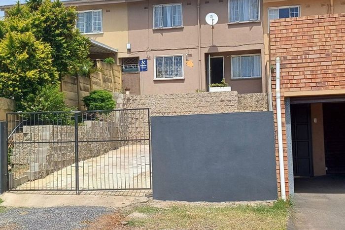 For Sale: Longcroft Townhouse with 3 bedrooms, 4 parking spaces, and open-plan living.
