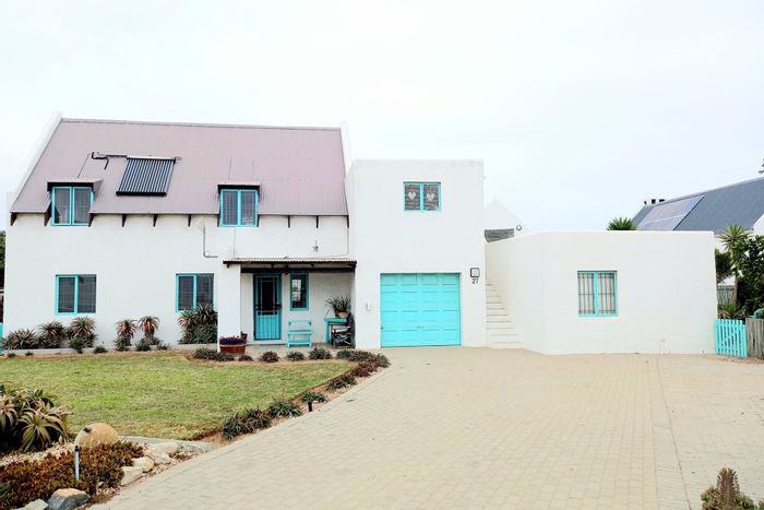 Jacobsbaai House For Sale: Two apartments, spacious living, braai area, secure parking.