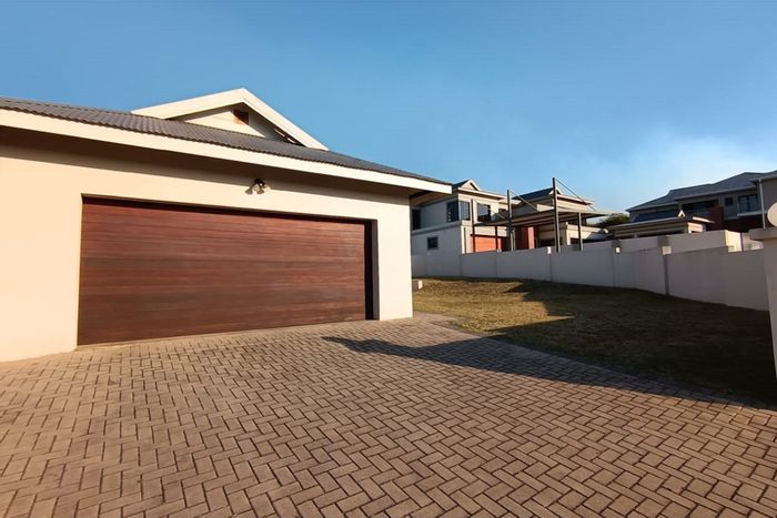 For Sale: House in Fairlands Estate with 3 bedrooms, garden, and 2-car garage.