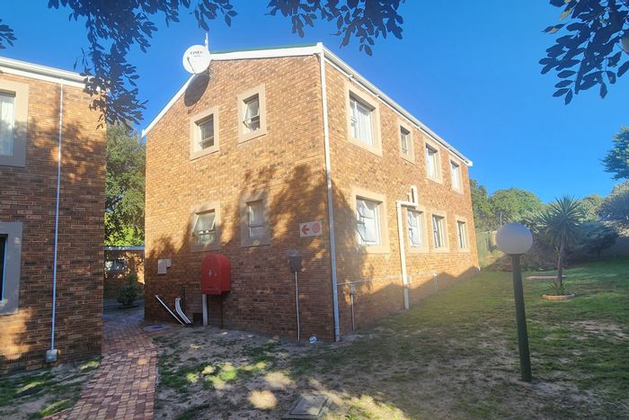 For Sale: Oakglen Apartment with 2 Bedrooms, Garage, Pool, and Rental Income.
