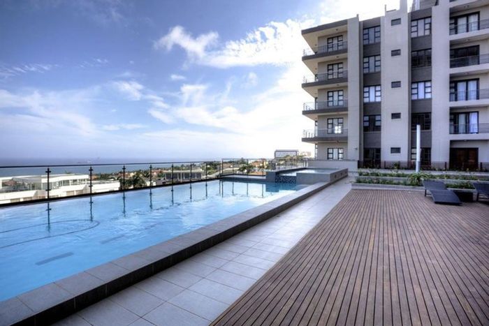 Umhlanga Ridge Apartment For Sale: 2 beds, pool access, sea views, secure living.