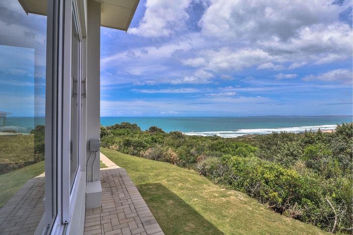 For Sale: House in Moquini Coastal Estate with pool, solar panels, and beach views.