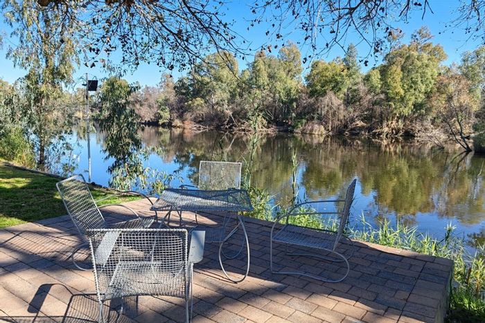 1-Bedroom Apartment for Sale in Parys Central, secure riverfront complex with amenities.