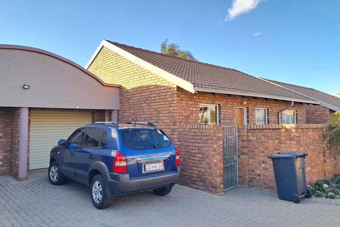 For Sale: 2-Bedroom Townhouse in Amberfield Heights with private garden and garage.