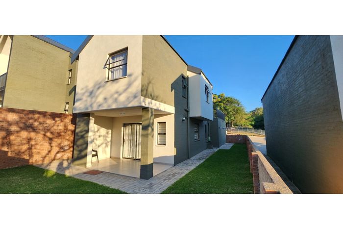 For Sale: Townhouse in Stonehenge Ext 1 with garage, pool, and private garden.