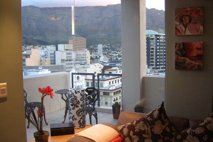 Cape Town City Centre Apartment For Sale: Table Mountain views, 21 sqm balcony, Airbnb-ready.