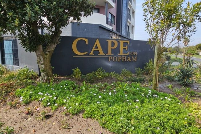 2-Bedroom Apartment To Rent in Bloubergstrand with balcony, parking, and pet-friendly.