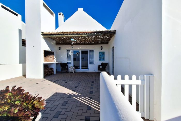 Coastal house for sale in Britannia Bay with patio, garage, and security features.