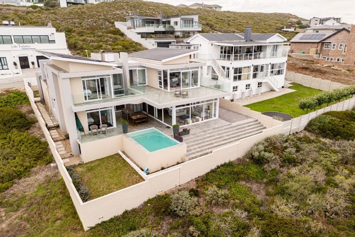 House for Sale in Yzerfontein Central: Ocean views, open-plan living, 4 en-suites.