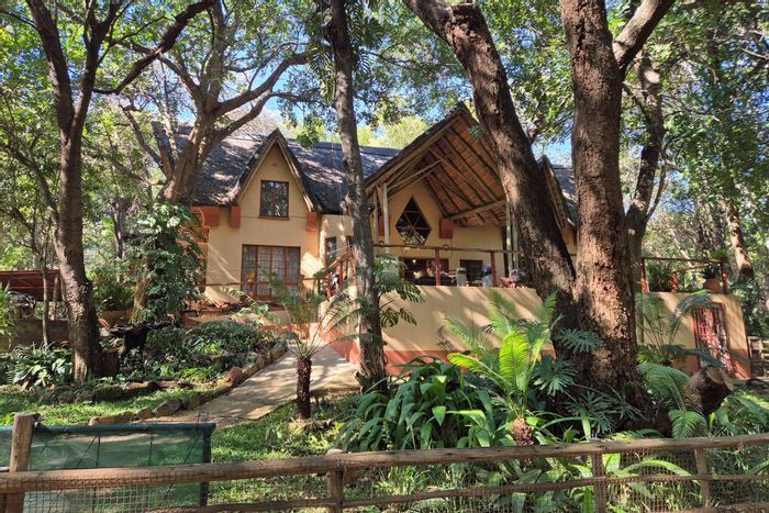 House for Sale in Blyde River Botanical Reserve: Three homes, river access, vast gardens.