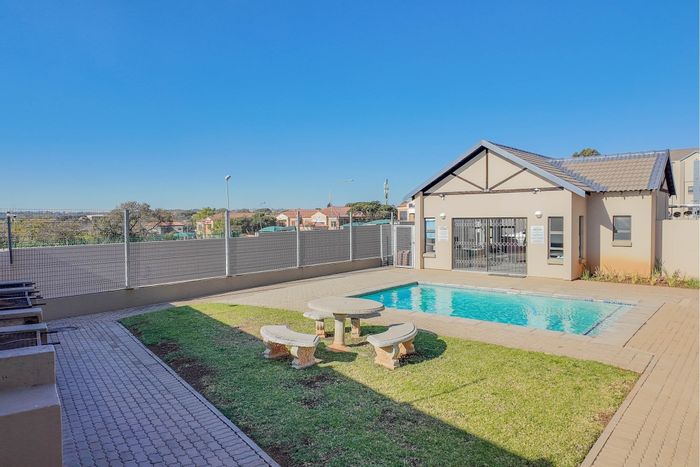 For Sale: Apartment in Ruimsig with 2 beds, pool, clubhouse, and security.