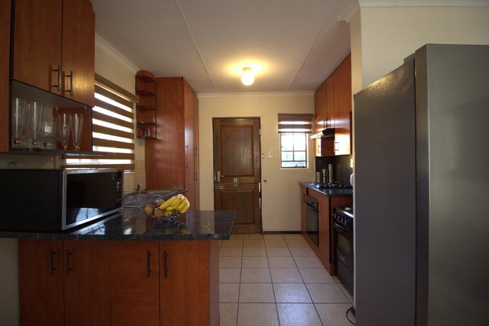 3-Bedroom House For Sale in Cosmo City with garage, veranda, and security features.