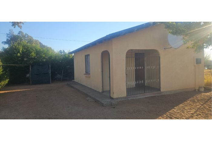 Affordable 2-bedroom house in Roodepan, For Sale with security and storage options.