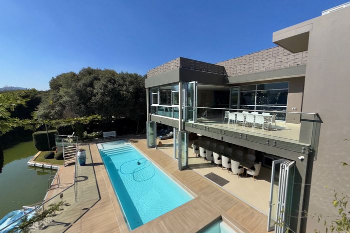 Canal-front house in The Islands Estates with luxury amenities, 6 bedrooms, for sale.