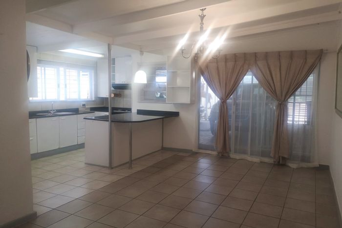 Cottage To Rent in Highway Gardens: Private entrance, parking, garden, and spacious bedroom.