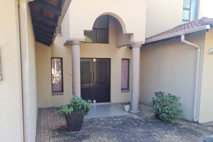 For Sale: Spacious Ruimsig house with pool, patio, and golf estate access.