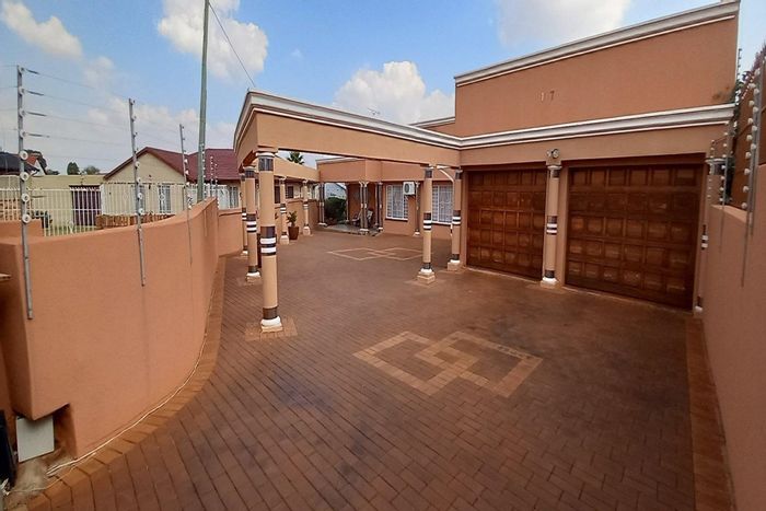 For Sale: Spacious 4-bedroom house in Lenasia South with ample parking and security.