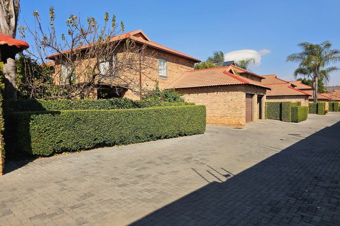 Townhouse for sale in Six Fountains: 3 beds, garden, double garage, security.