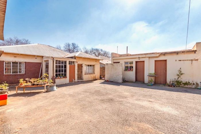 For Sale: House in Rosettenville with spacious backyard, rental rooms, and garage.