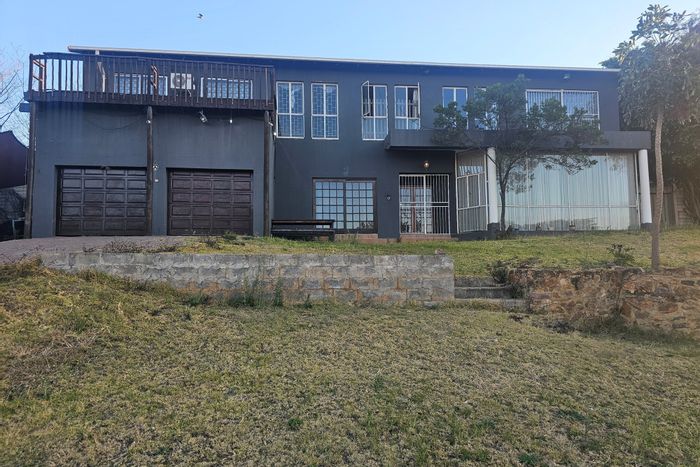 For Sale: House in Hoeveld Park with 4 bedrooms, double garage, and rental income.