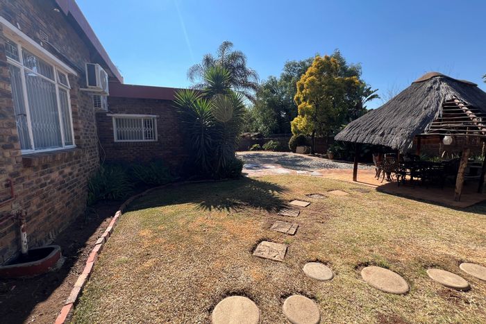 Spacious Rooihuiskraal house for sale with pool, garage, and maid's quarters.