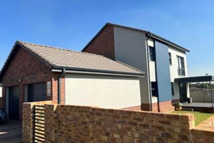 For Sale: 4-Bedroom House in Cosmo City with garden, garage, and security features.