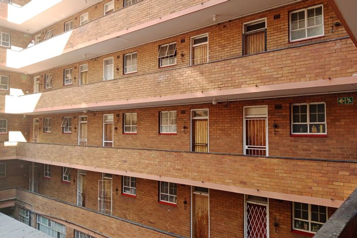 For Sale: Apartment in Pretoria Central, secure building, near transport and amenities.