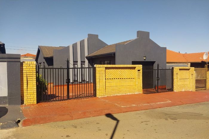 3-Bedroom House For Sale in Protea North with garage and paved yard.
