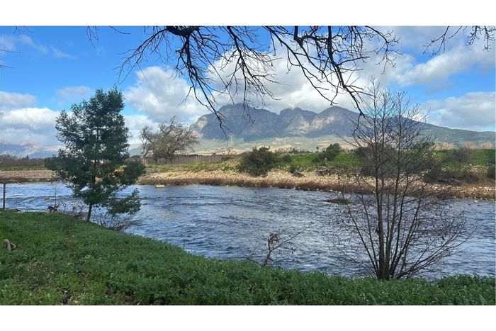 Paarl South Farm For Sale: 23 hectares, irrigation, water rights, and conversion potential.