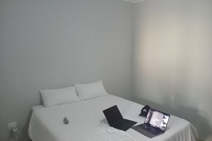 1-Bedroom House To Rent in Lombardy East with WiFi, secure parking, and electric fence.