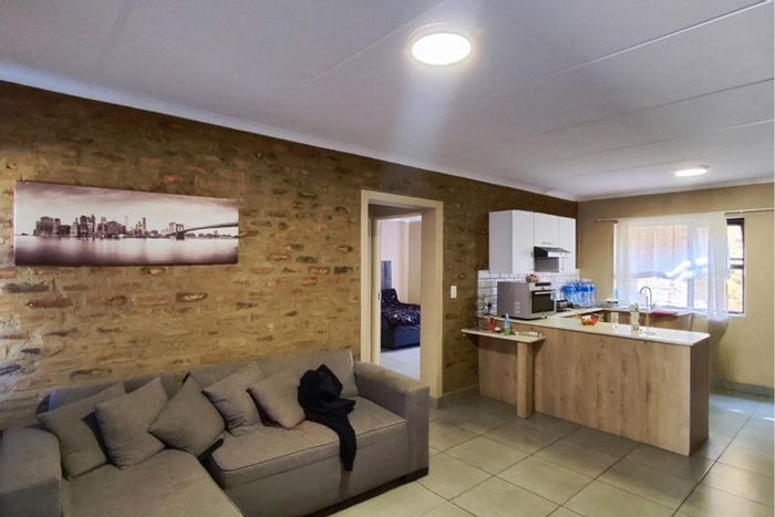 For Sale: 2-bedroom apartment in Pomona with pool, patio, and secure parking.