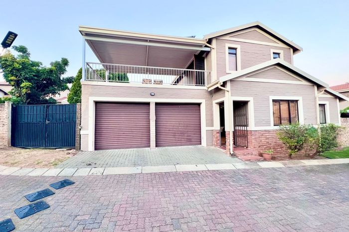 For Sale: Carlswald Townhouse with 4 beds, double garage, secure complex, solar power.