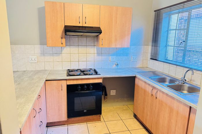 2-Bed Apartment To Rent in Halfway Gardens with garden, pool, and 24hr security.