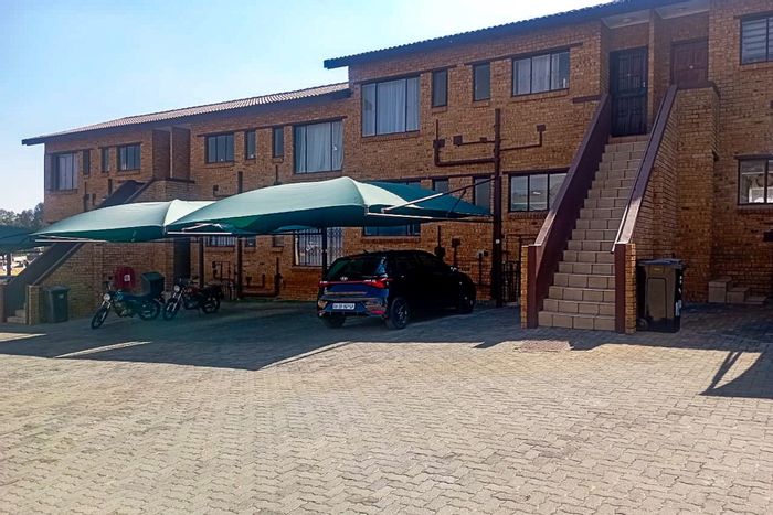 For Sale: Meredale Townhouse with pool access, 2 beds, parking, and convenience.