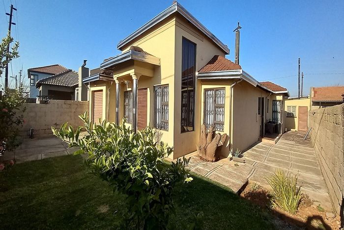 For Sale: House in Protea Glen with garden, garage, and approved expansion plans.