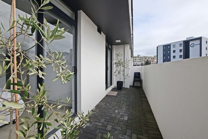 Waves Edge Apartment For Sale: 2 beds, private patio, close to beach and mall.