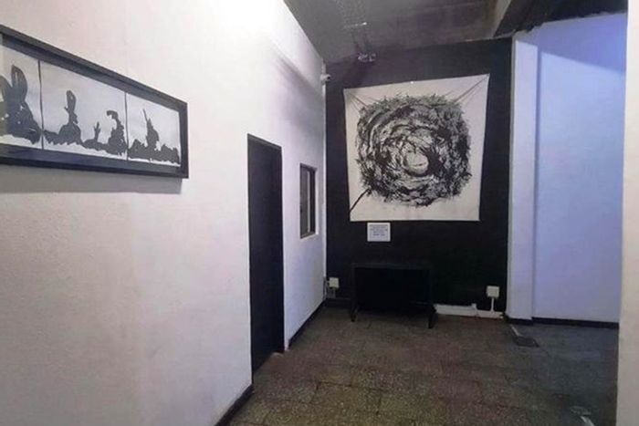 Maboneng Apartment For Sale: Tenant-occupied, lift access, 24/7 security, prime location.