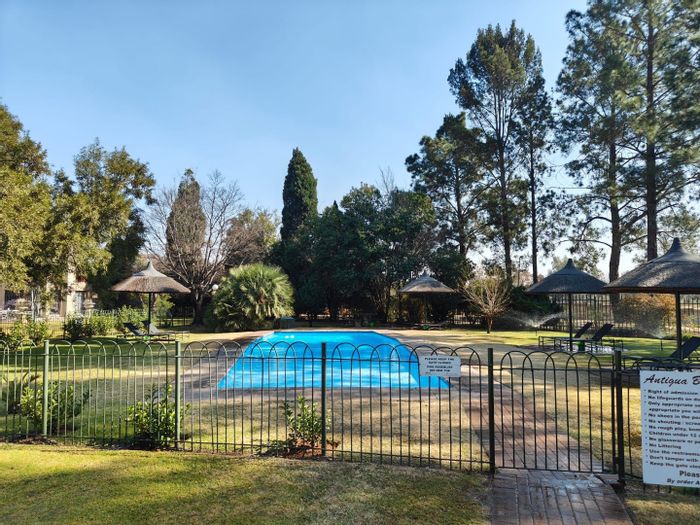 For Sale: Vaalpark Flat with river access, pool, tennis court, and secure parking.