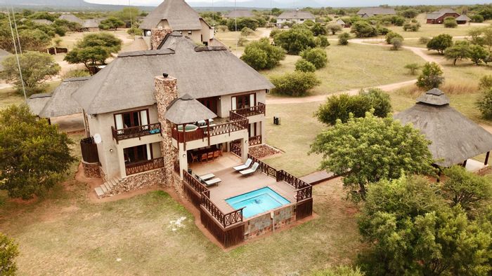 For Sale: House in Zebula Golf Estate with pool, fire pit, and 10% share.