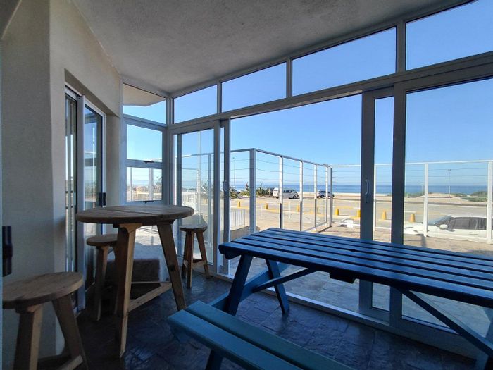 Beachfront Apartment For Sale in Jeffreys Bay Central with enclosed patio and parking.
