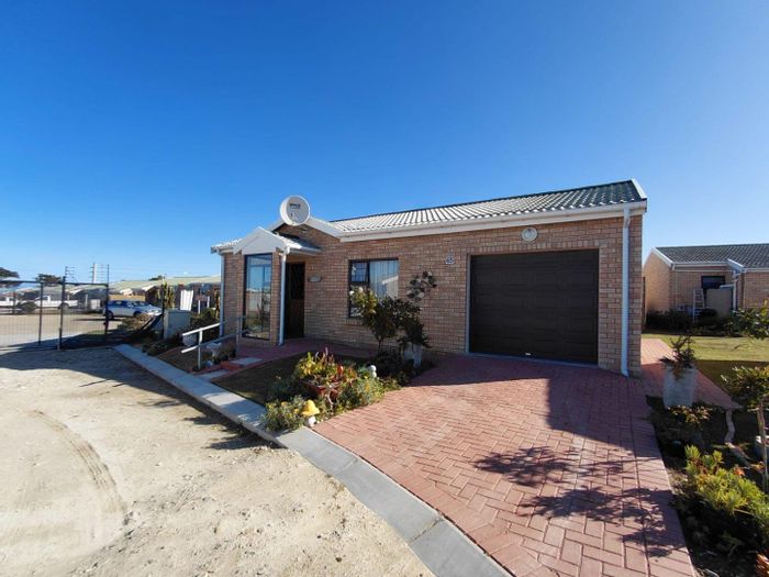 Townhouse for Sale in Jeffreys Bay Central: Secure living with health services and community activities.