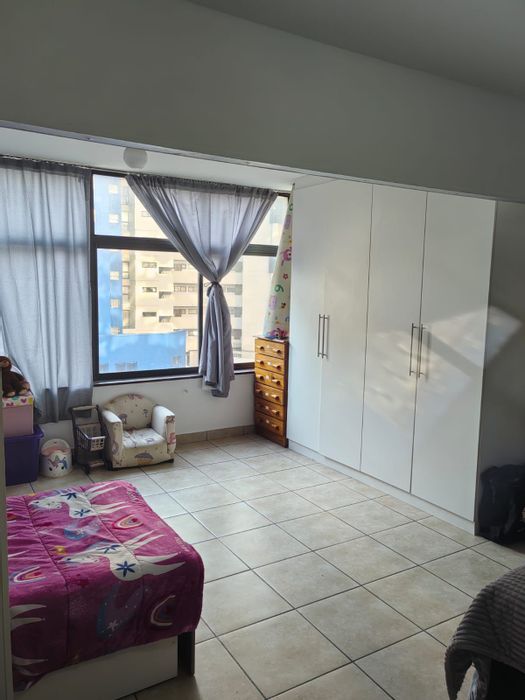 South Beach Apartment For Sale: Open-plan living, sea views, 24-hour security.