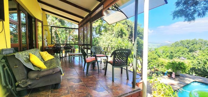 Umtentweni House For Sale: Pool, large garden, garage, and security features.